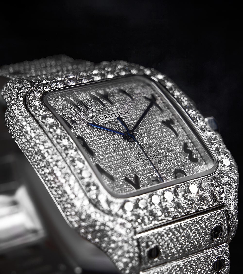 Image of a Cartier Santos Large, fully custom diamond-set with a diamond-paved dial featuring black Arabic numerals, crafted by Cagau.