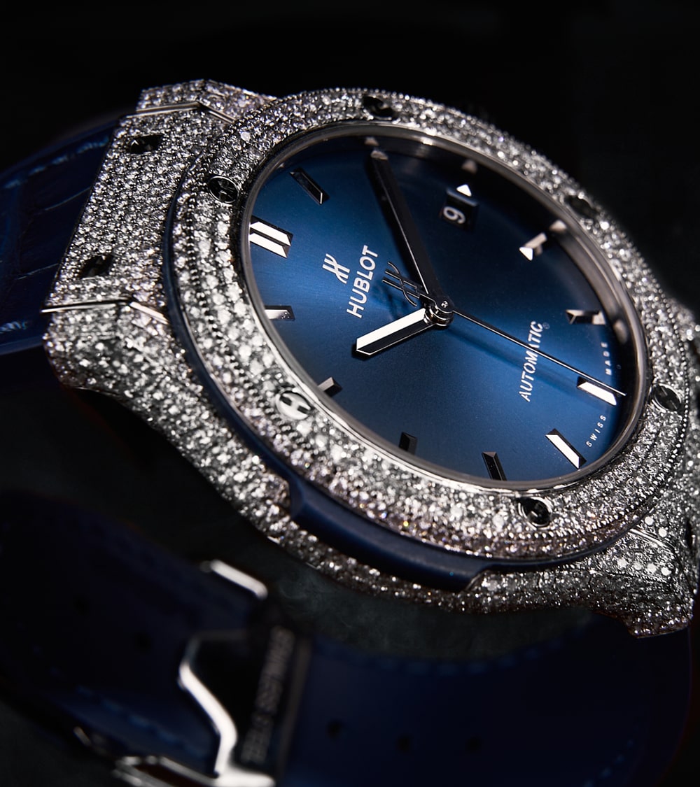 Image of a Hublot Classic Fusion 45 mm watch in titanium blue, custom-set with diamonds by Cagau.