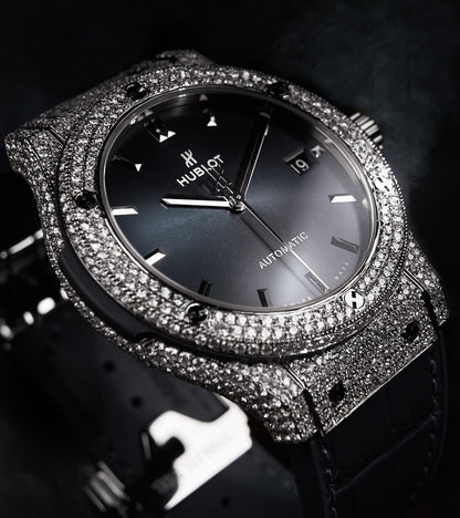 Hublot Classic Fusion 42 mm Racing Grey Titanium watch with custom diamond-set bezel, showcasing luxury design and craftsmanship.