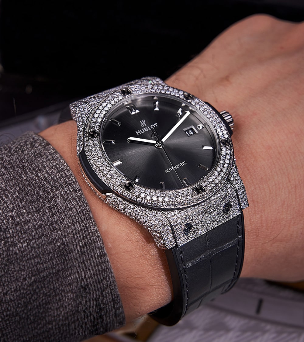 Hublot Classic Fusion 42 mm Racing Grey Titanium watch with custom diamond-set bezel, showcasing luxury design and craftsmanship.