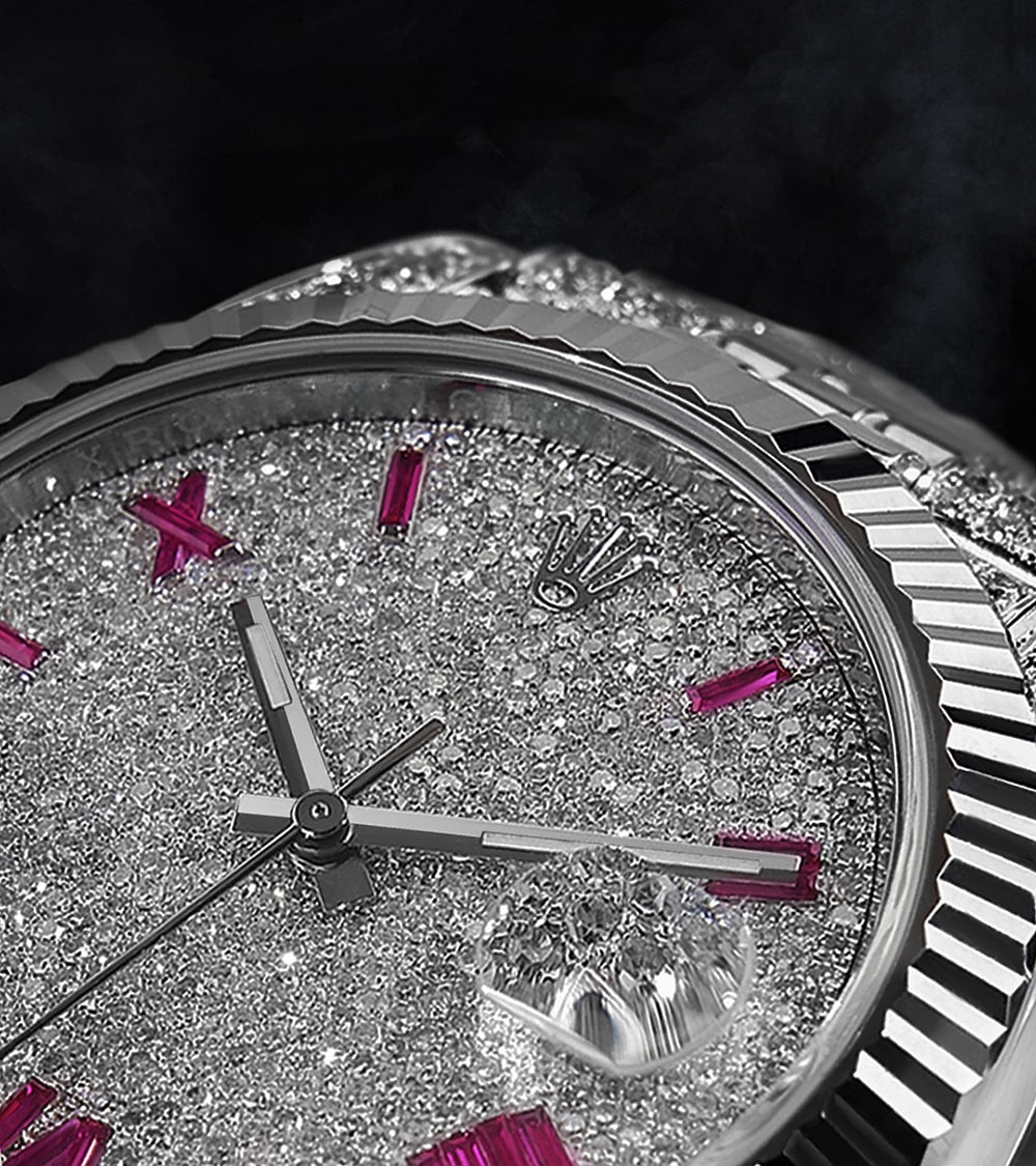 Image of a Rolex Datejust 41 with a custom diamond-set case and bracelet, featuring a dial with ruby-colored Roman numeral markers by Cagau.