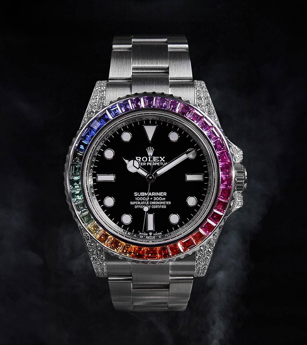 Image of a Rolex Submariner 41mm with a black dial and a custom rainbow bezel by Cagau.