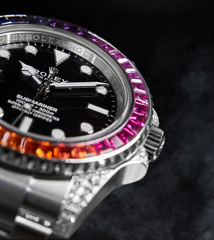 Image of a Rolex Submariner 41mm with a black dial and a custom rainbow bezel by Cagau.